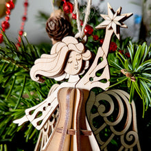 Load image into Gallery viewer, Detailed laser-cut Christmas Angel ornament featuring a star and flowing robes
