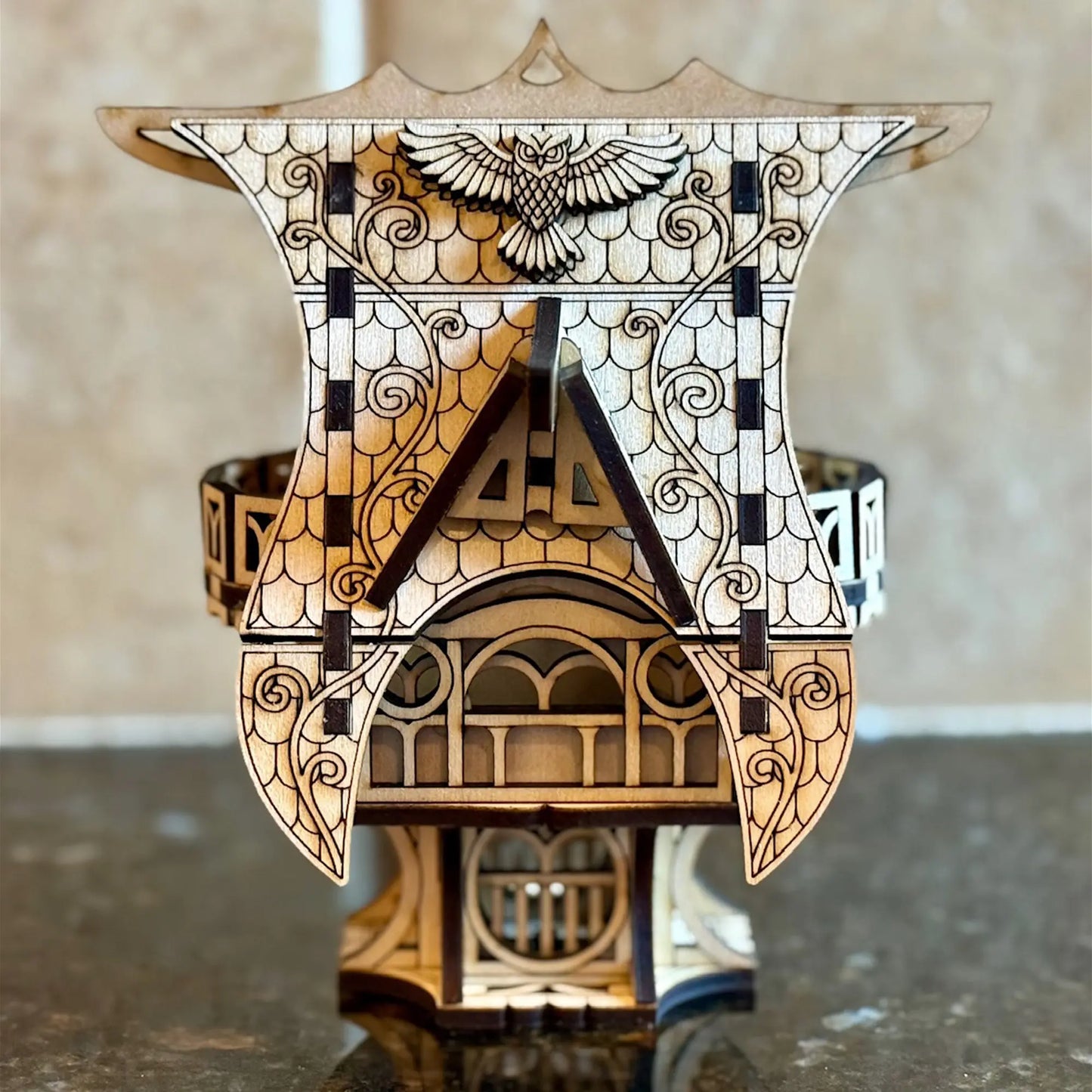 A crisp straight front view of a whimsical miniature fairytale house model, crafted from fine detailed laser cut plywood