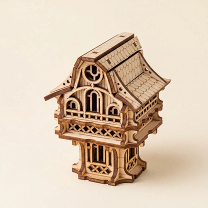 Wooden model of a fairy-like structure on a beige background
