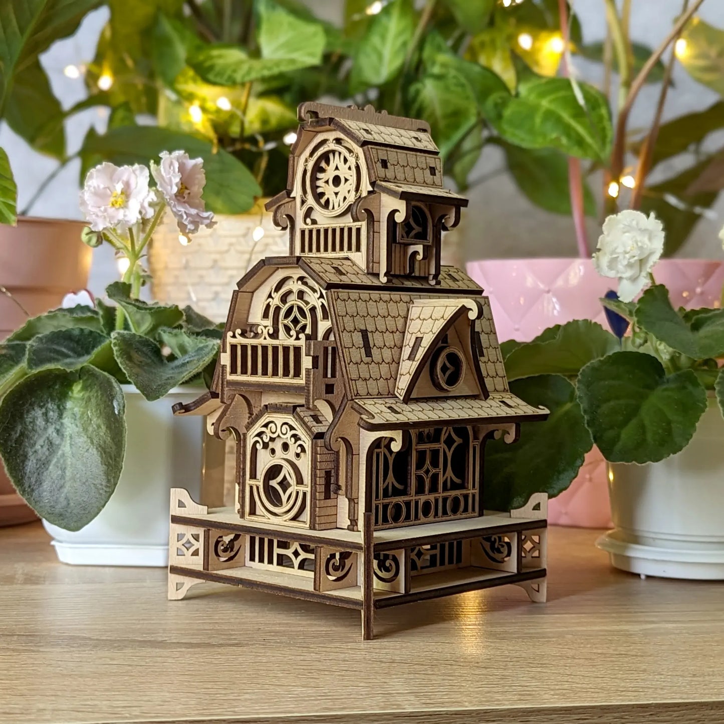 Detailed digital lifestyle photo of the completed 3D puzzle house model, constructed of laser cut plywood plates.