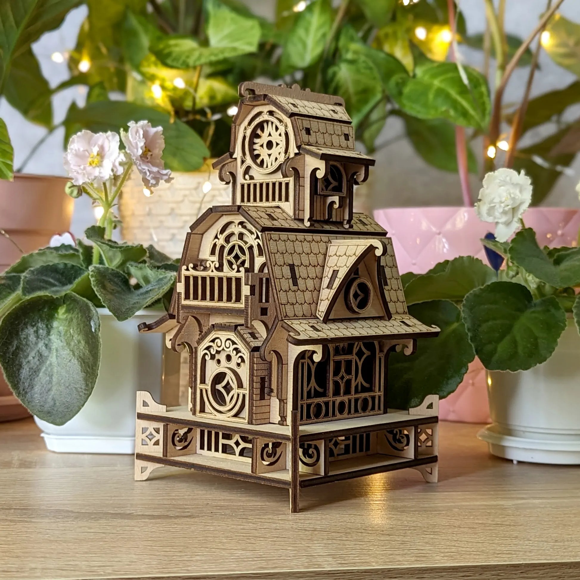 Detailed digital lifestyle photo of the completed 3D puzzle house model, constructed of laser cut plywood plates.