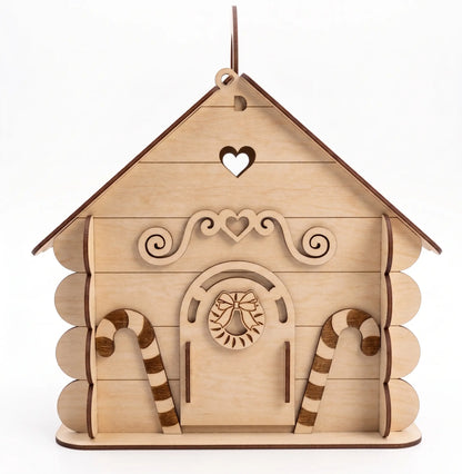 Wooden house-shaped ornament with candy cane designs on a white background