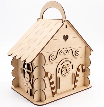 Wooden house-shaped box with decorative elements on a white background