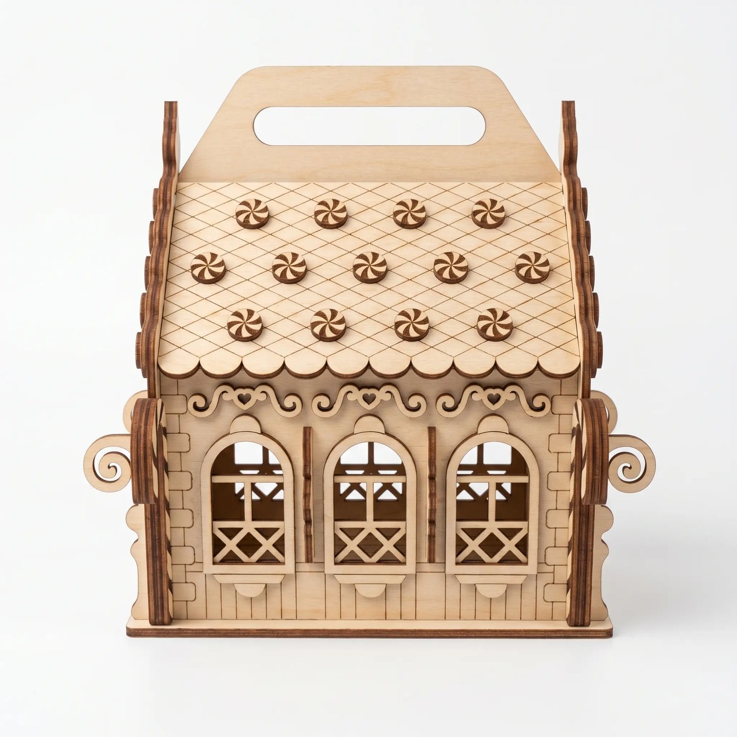 Wooden gingerbread house model on a white background