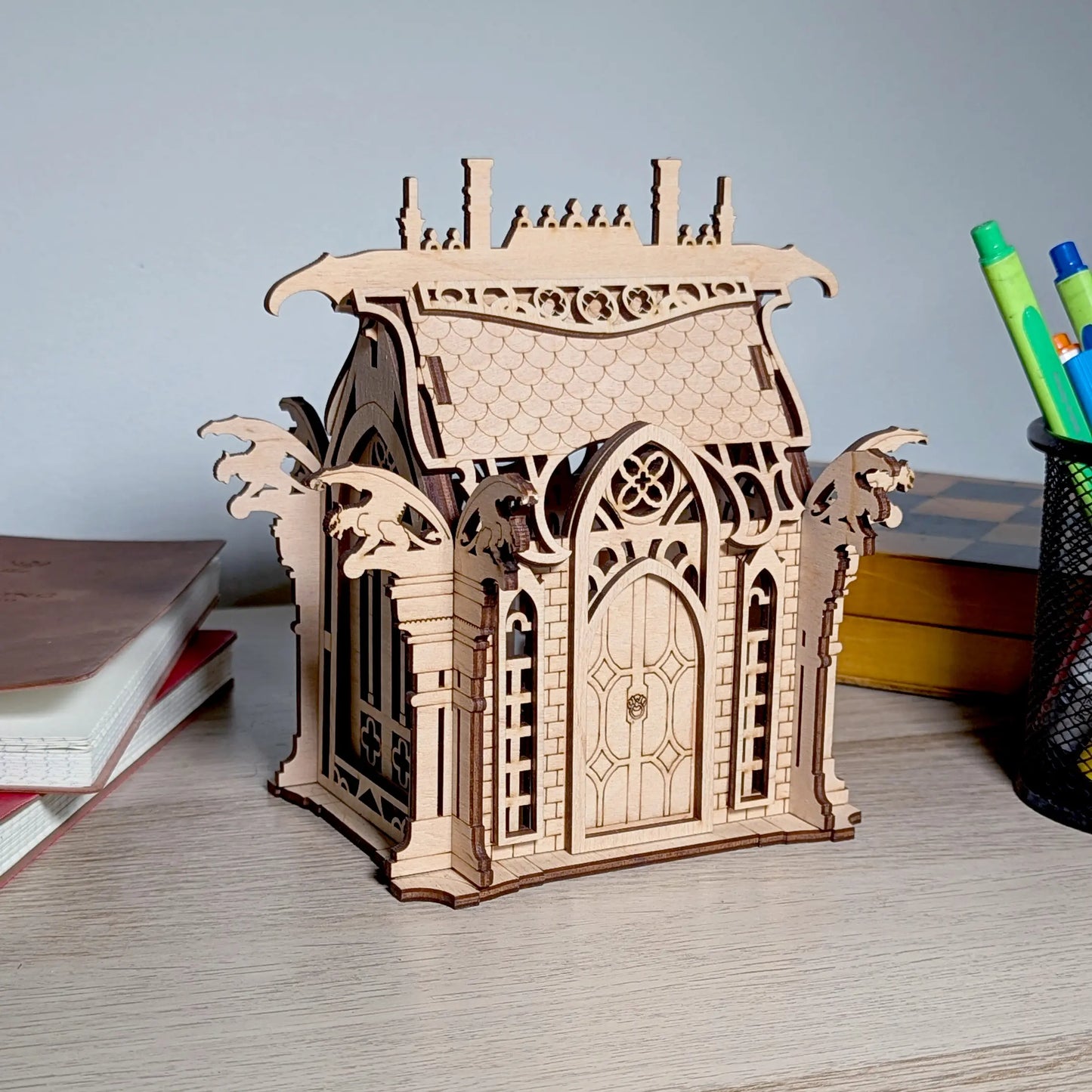 A beautiful angled perspective view of an assembled gothic fantasy crypt centerpiece crafted from fine laser cut plywood.