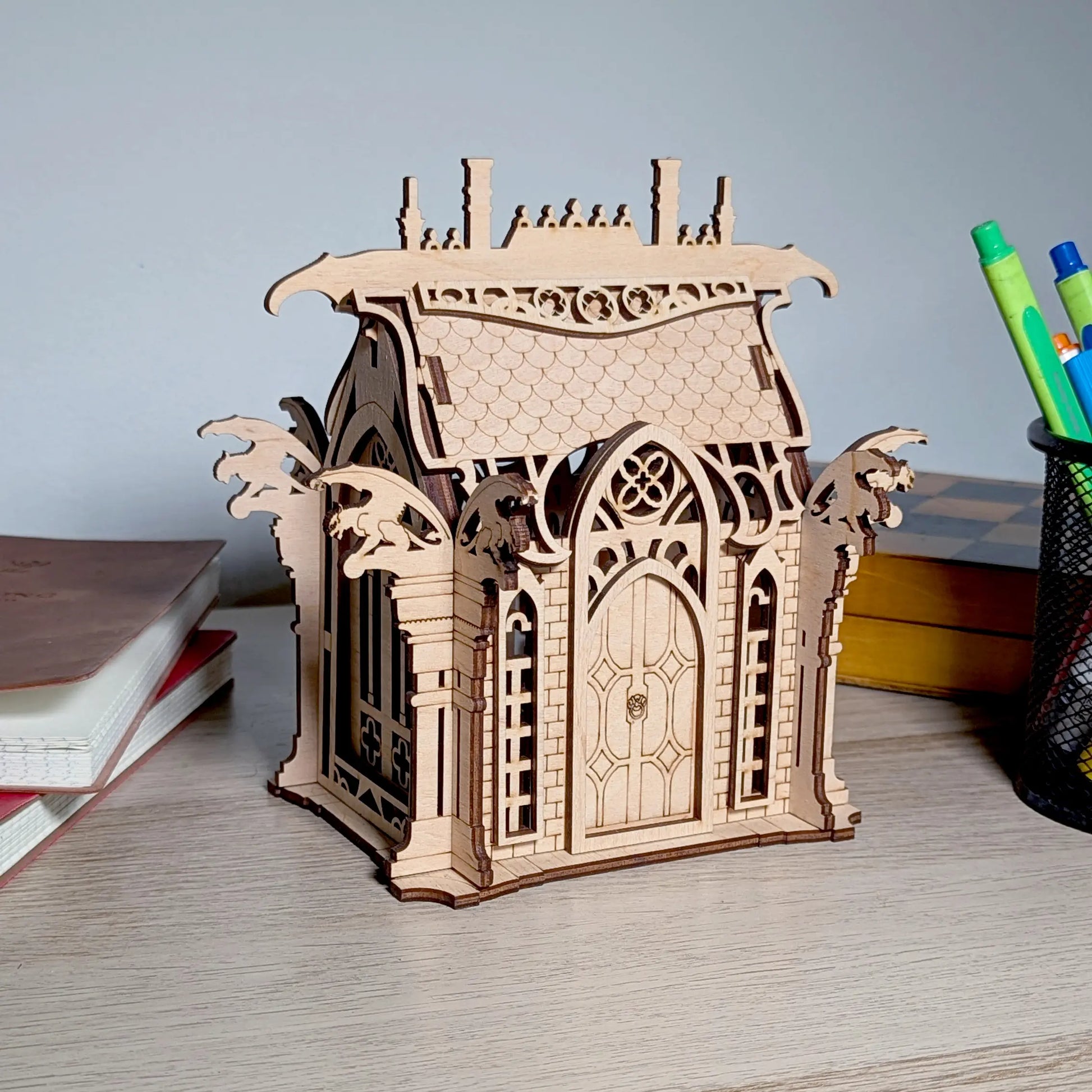 A beautiful angled perspective view of an assembled gothic fantasy crypt centerpiece crafted from fine laser cut plywood.