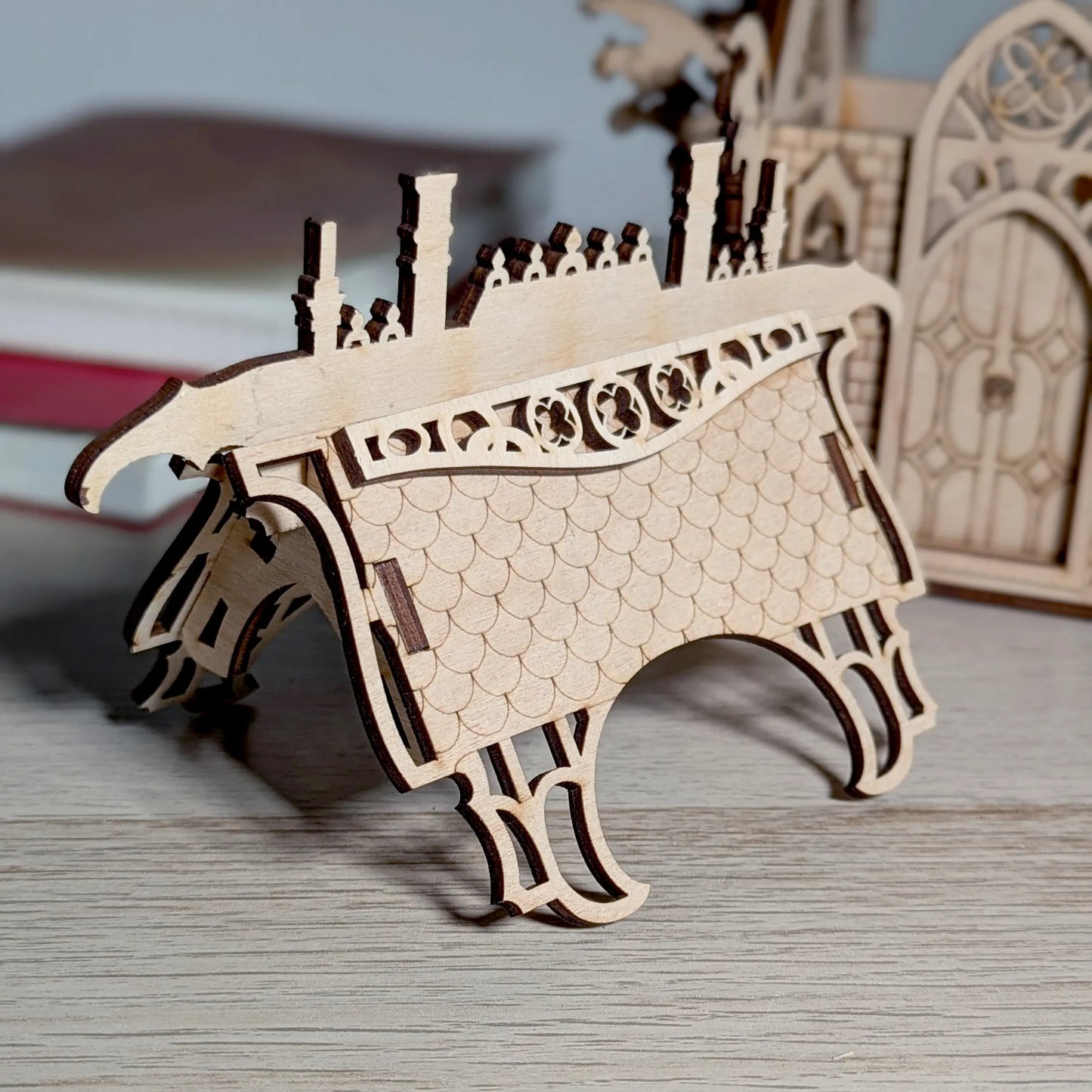 Detailed close-up photo of a miniature gothic cathedral roof structure showcasing interlocking tabs of laser cut plywood.