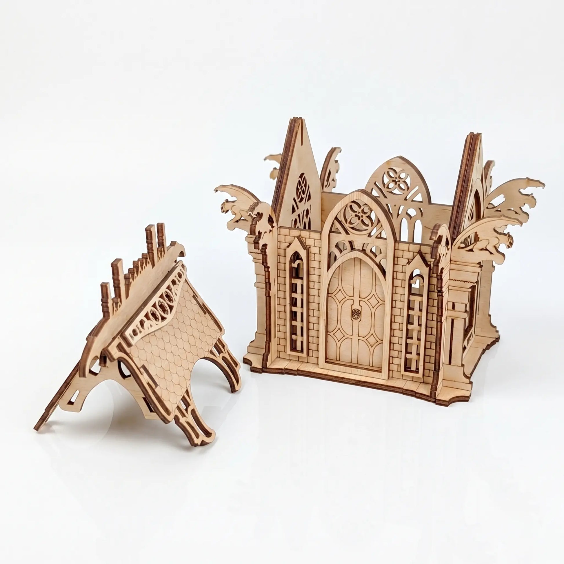 Wooden laser cut model of a gothic cathedral on a white background