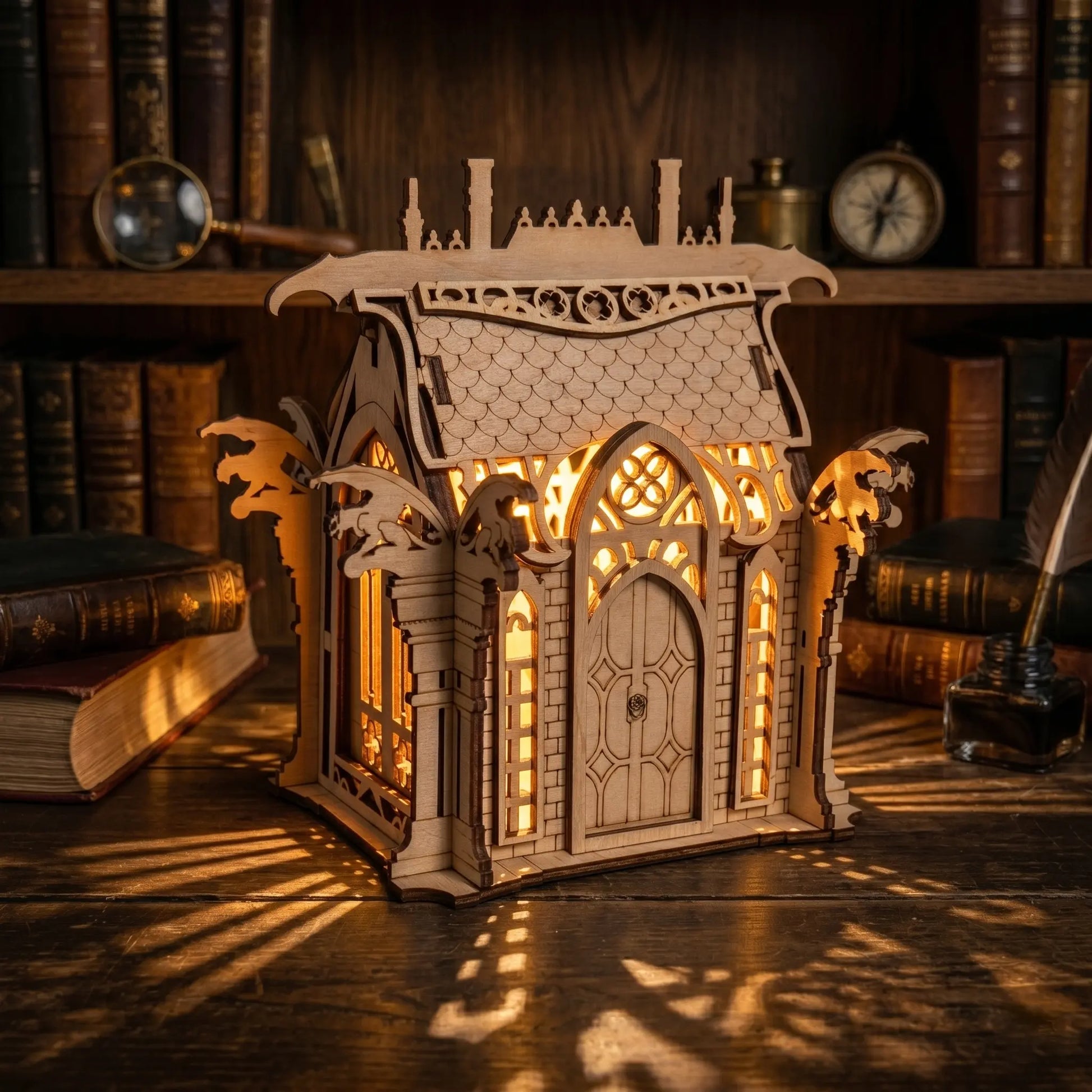 Decorative wooden lantern with intricate design on a wooden surface with books in the background