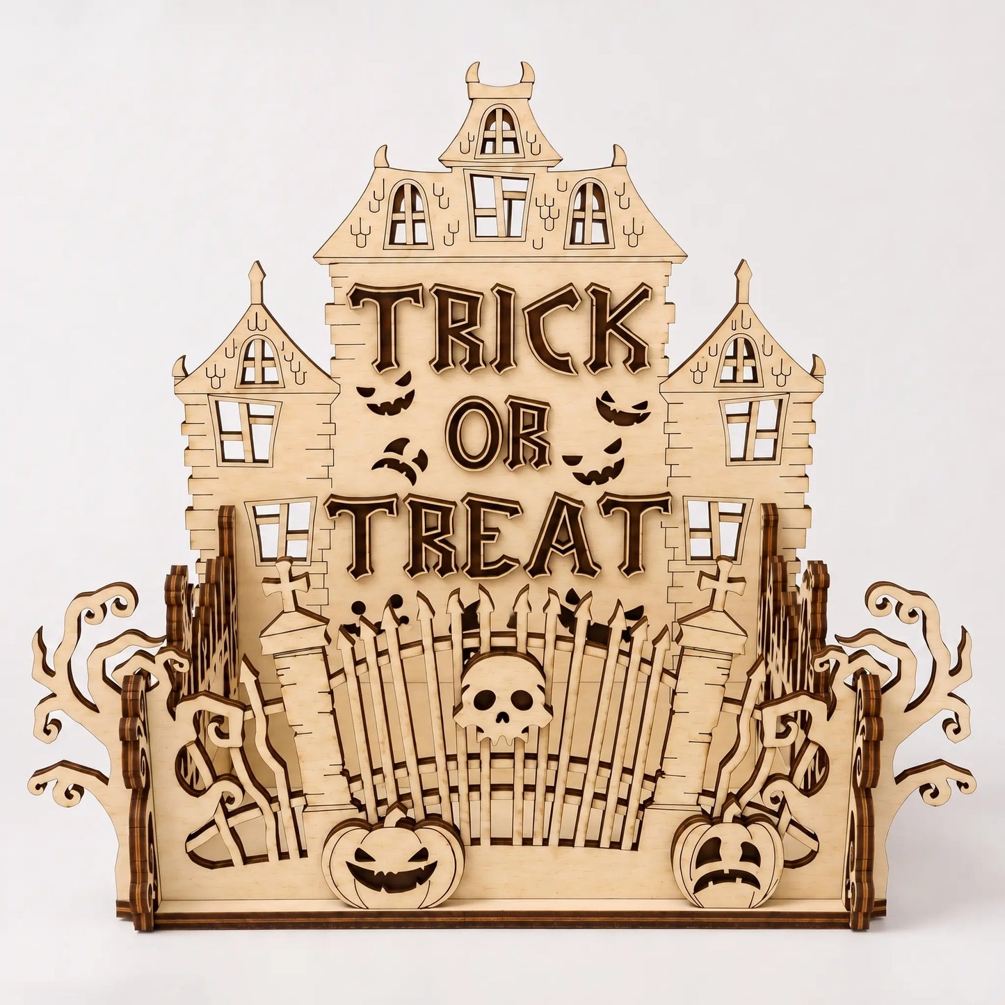 Wooden Halloween-themed decorative piece with 'Trick or Treat' text on a white background