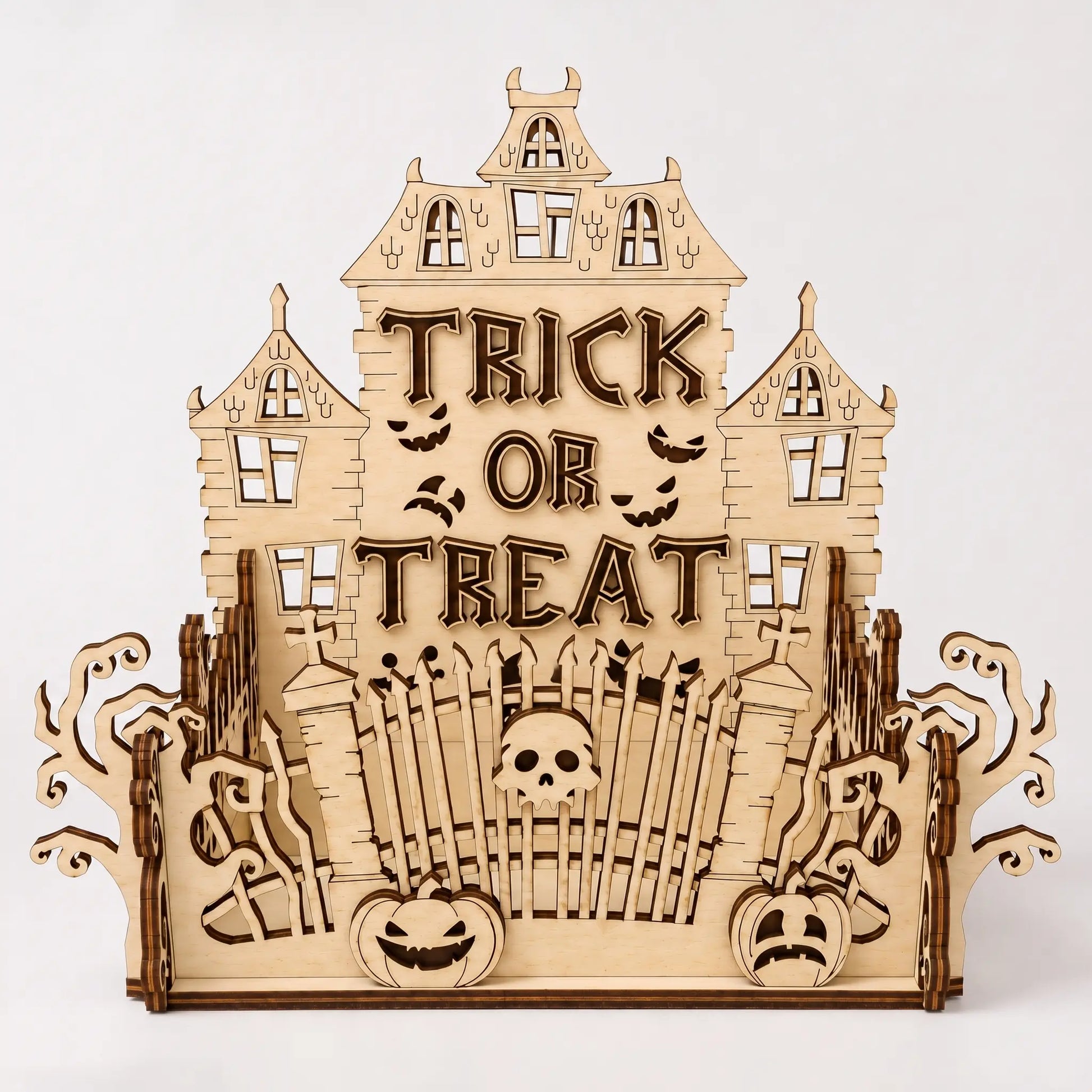 Wooden Halloween-themed decorative piece with 'Trick or Treat' text on a white background