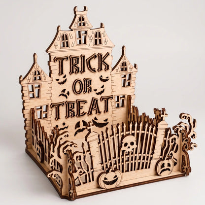 Wooden Halloween-themed decorative piece with 'Trick or Treat' text on a white background