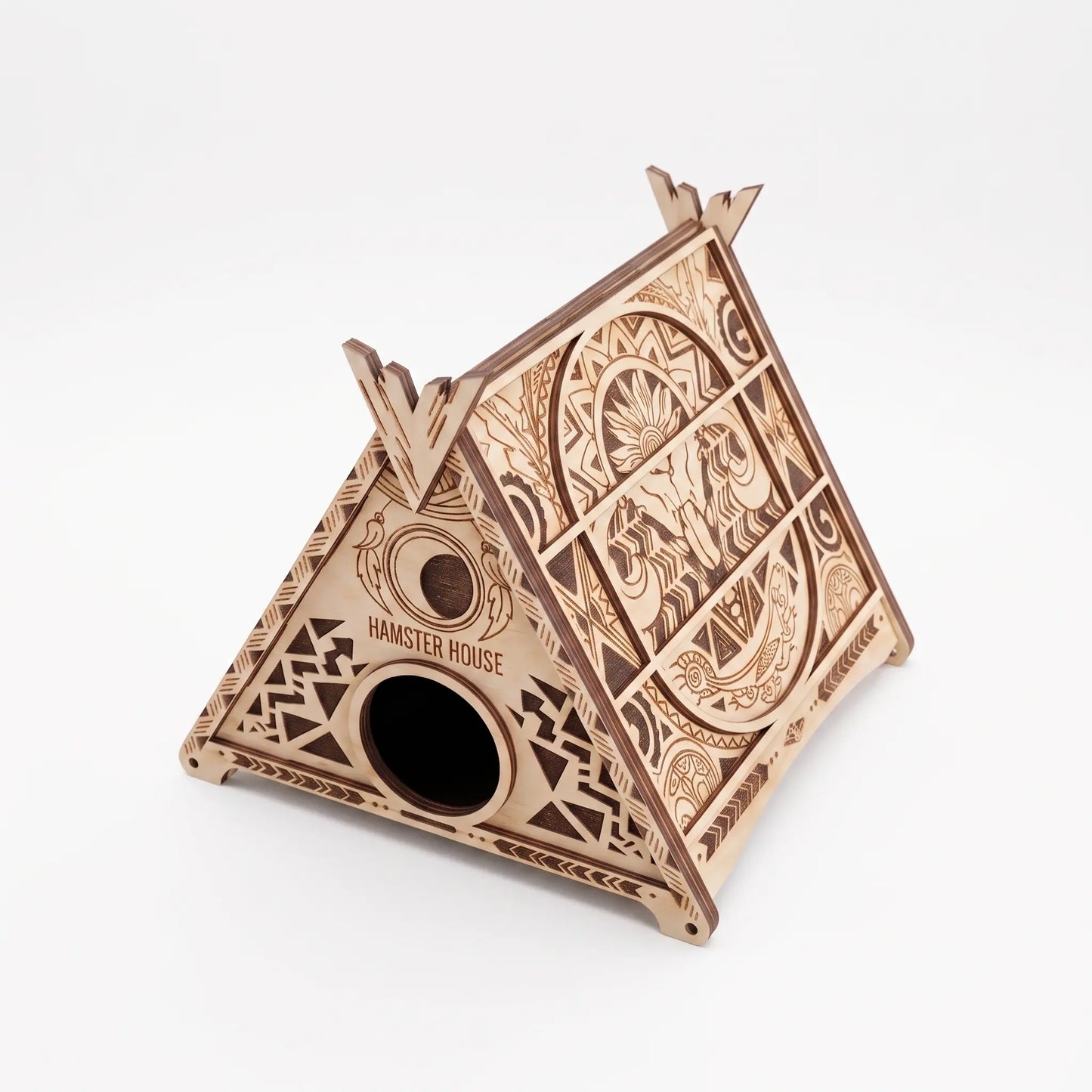 A wooden birdhouse with intricate designs and patterns carved into its surface.