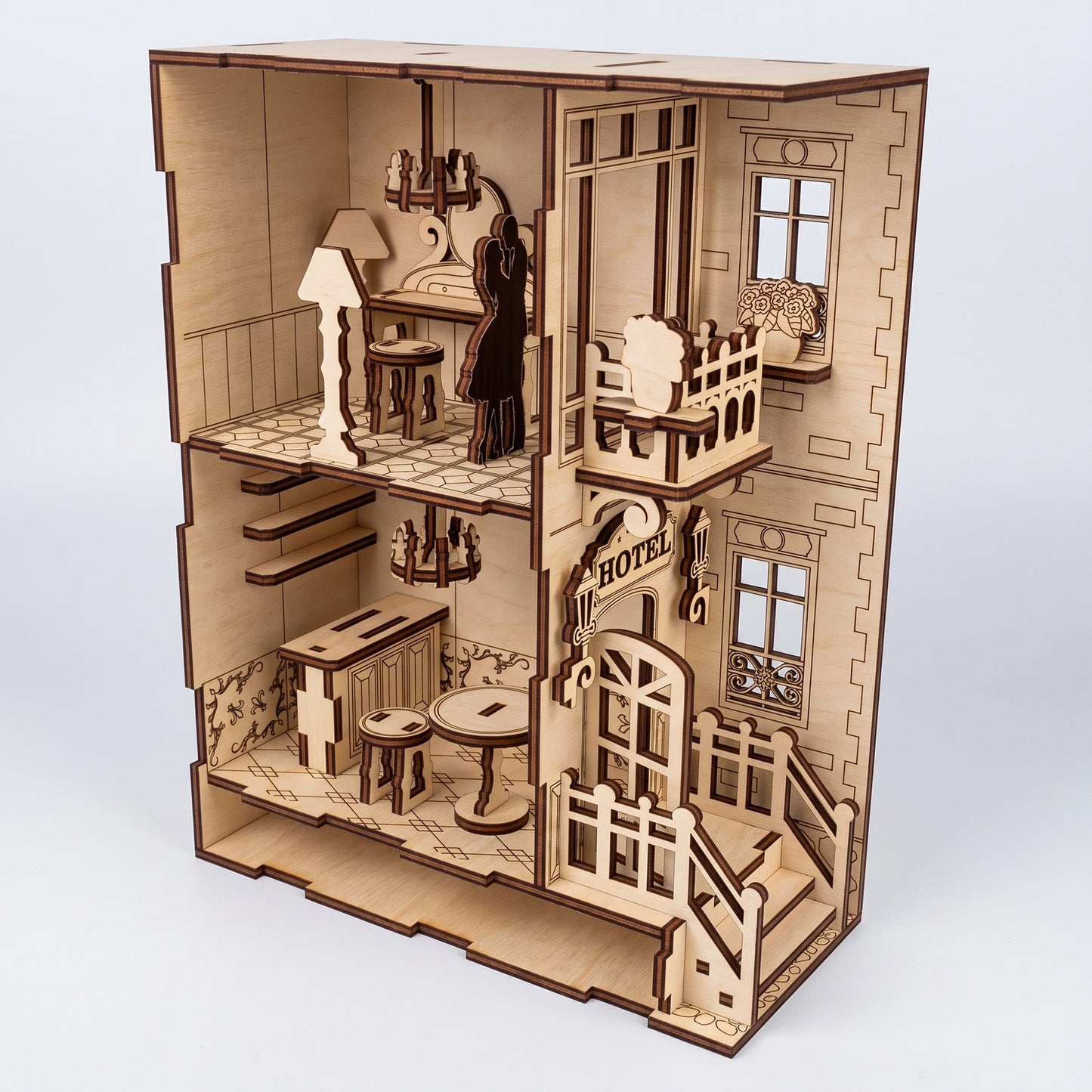 Full view of a multi-level laser-cut birch plywood hotel model. Features intricate interior furniture, natural wood finish, and realistic dark burnt edges.