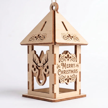 Assembled laser cut plywood holiday lantern with deer silhouette and Merry Christmas panel standing on white base