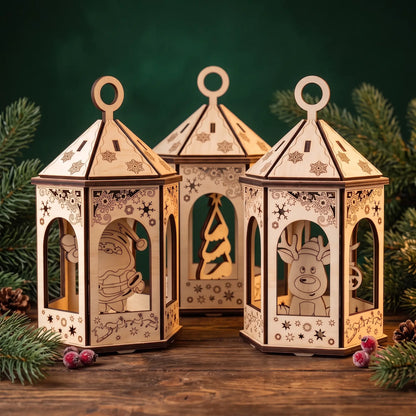 Trio of laser cut plywood holiday lanterns with Santa, reindeer, and tree silhouettes on rustic table with pine.