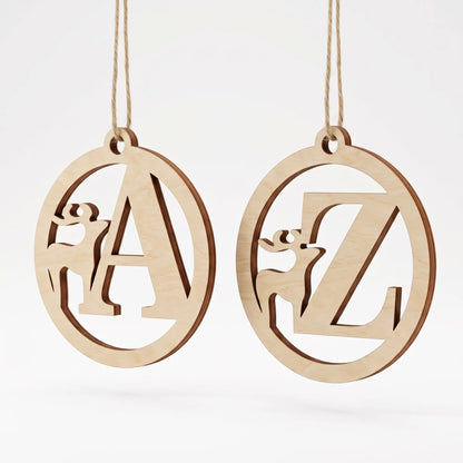 Two laser cut plywood holiday tree baubles featuring deer silhouettes and monogram letters A and Z on plain white.