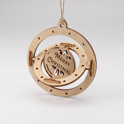 Laser cut plywood 3D kinetic spinning bauble with Merry Christmas center disc hanging isolated on white backdrop