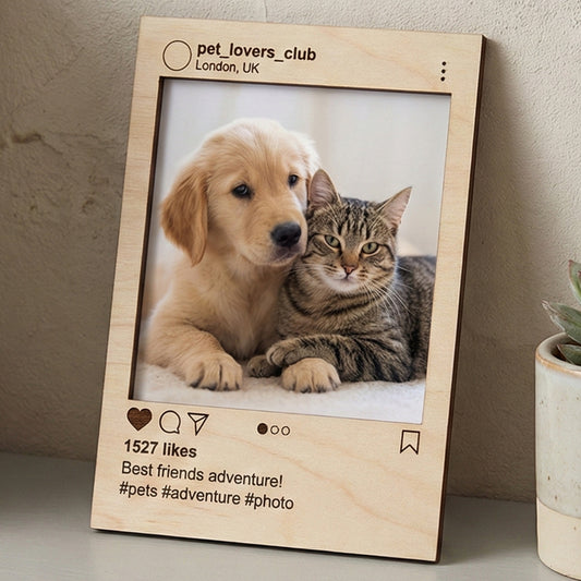 Laser cut wooden Instagram photo frame engraved with pet lovers club details and likes, holding a heartwarming puppy-kitten snapshot, on a cozy home shelf background.