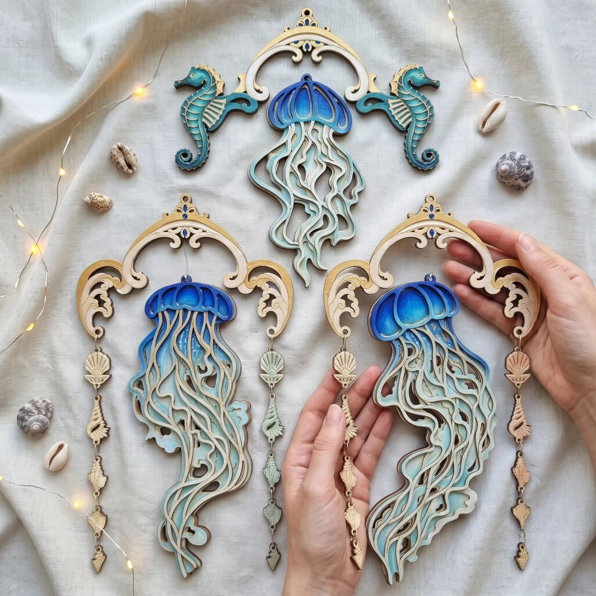 Three wooden jellyfish wall hangings laser cut plywood designs