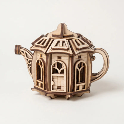 Wooden kettle laser cut model with intricate design on a white background