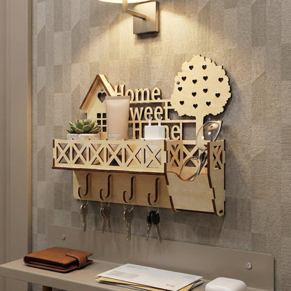 Cozy laser cut wooden keyholder featuring "Home Sweet Home" lettering, a decorative house frame, crisscross railing shelf, key hooks, and a whimsical heart-patterned tree, displayed against a warm textured wall background.