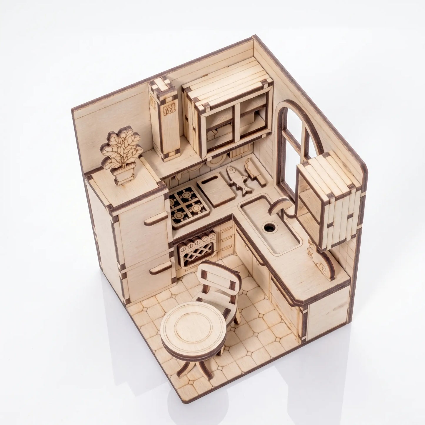 Wooden laser cut dollhouse kitchen set on a white background