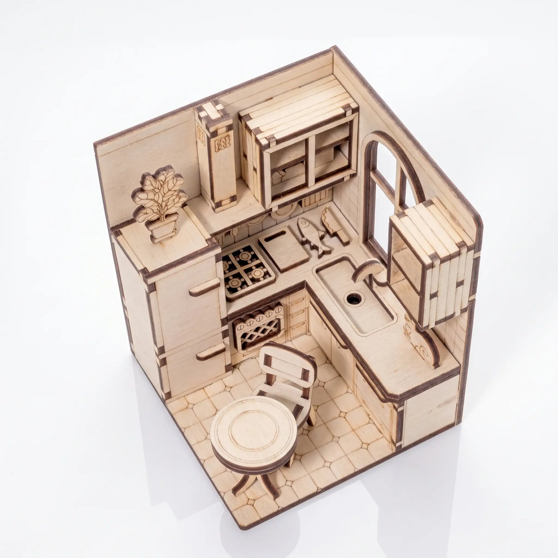 Wooden laser cut dollhouse kitchen set on a white background