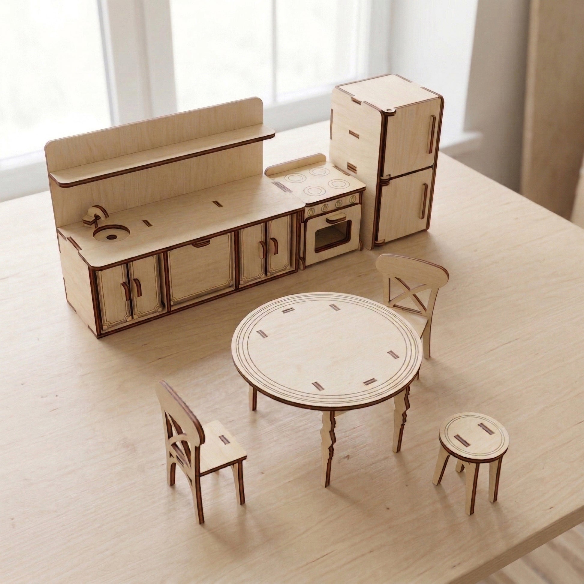 Miniature dollhouse kitchen set made of natural laser cut plywood. The set includes a tall refrigerator, a stove with oven details, and a sink cabinet. Precise wood edges and smooth finish, shown in a clean, assembled view.