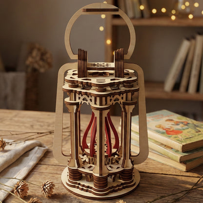 Intricate wooden laser cut Lantern showcasing a classic handle, decorative pillars, and central ribbon accents, placed on a table in a warm home interior background with books.
