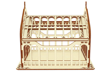 Side elevation view of a miniature Victorian greenhouse model constructed from light laser cut plywood over white.