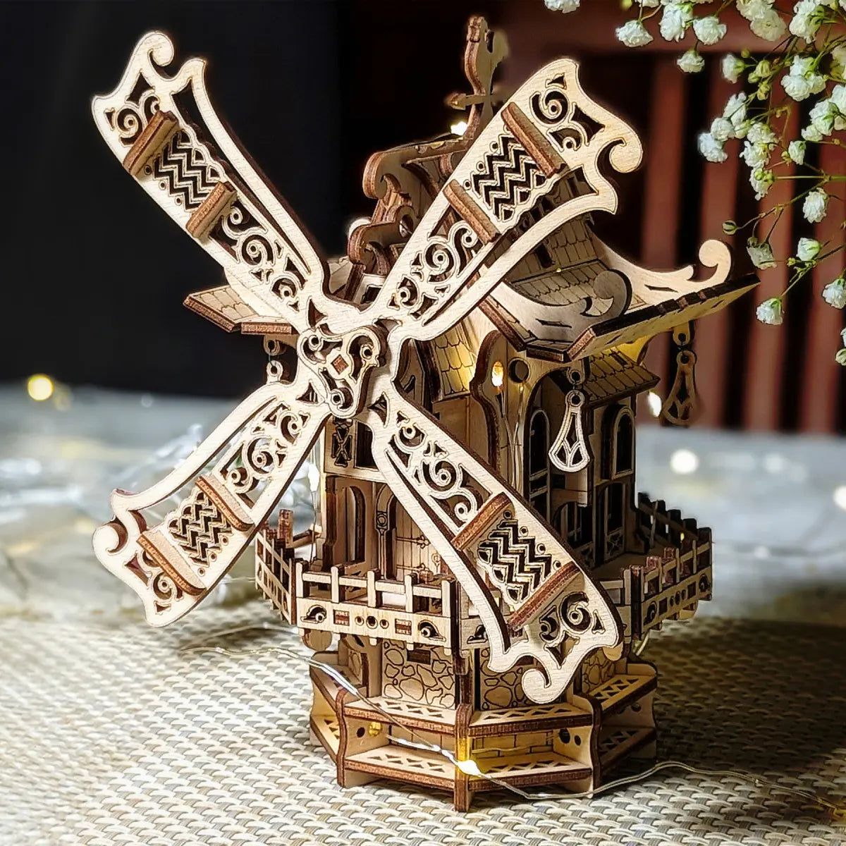 High-detaied laser cut file of Wooden windmill model with intricate design on a textured surface.
