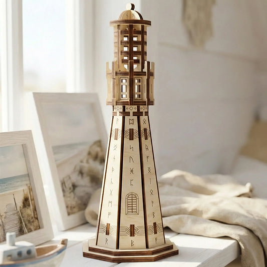 Miniature Viking lighthouse made of laser cut plywood staged near seaside picture frames in a sunny modern room.