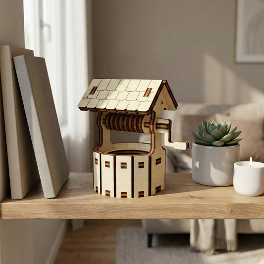 Elegant laser cut Little well model in wood with precise crank mechanism, overlapping roof tiles, and textured cylindrical base, shown in a gentle natural light indoor background.