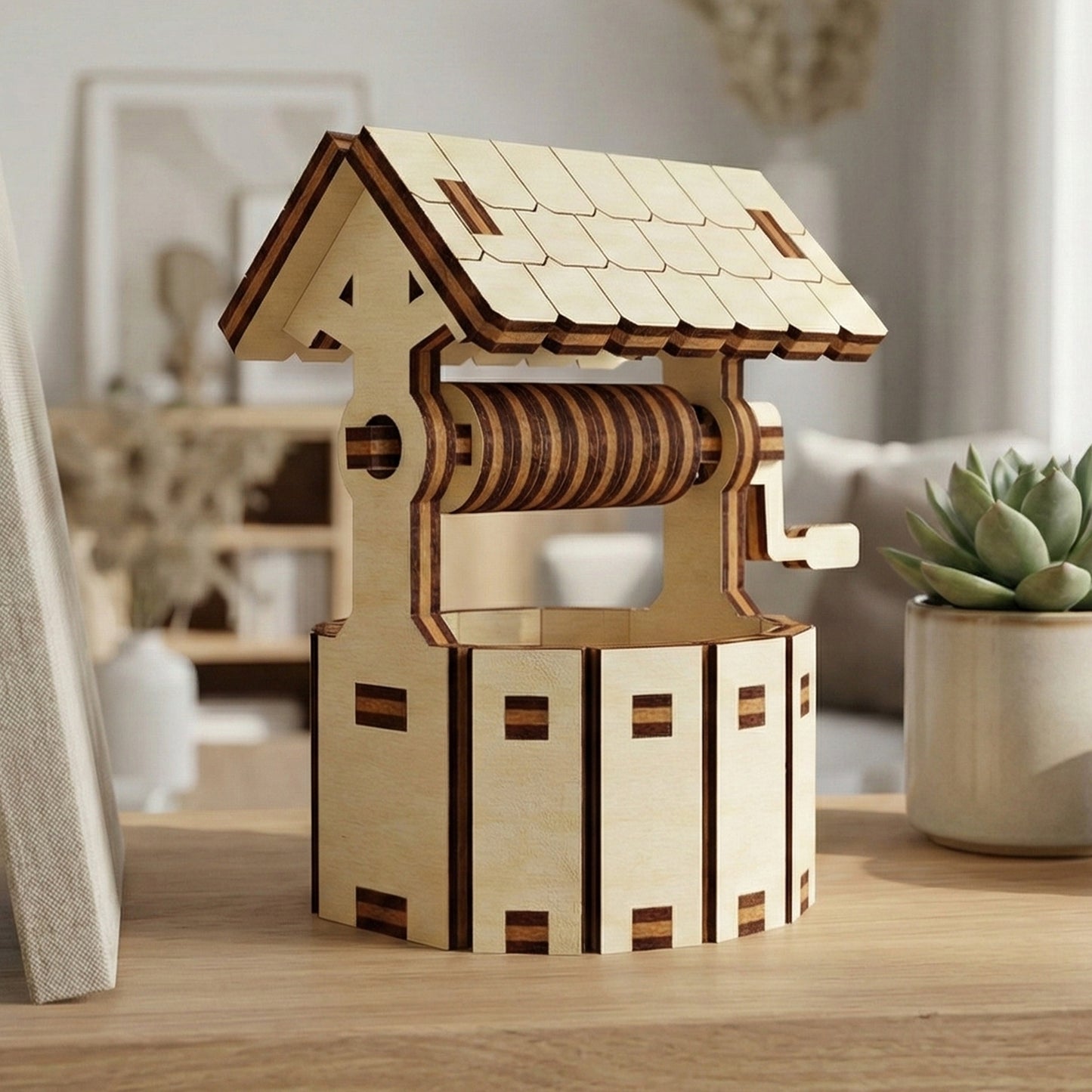 Detailed laser cut wooden Little well with scalloped roof edges, realistic crank and bucket system, and brick-like detailing, presented against a warm indoor setting background with natural light.
