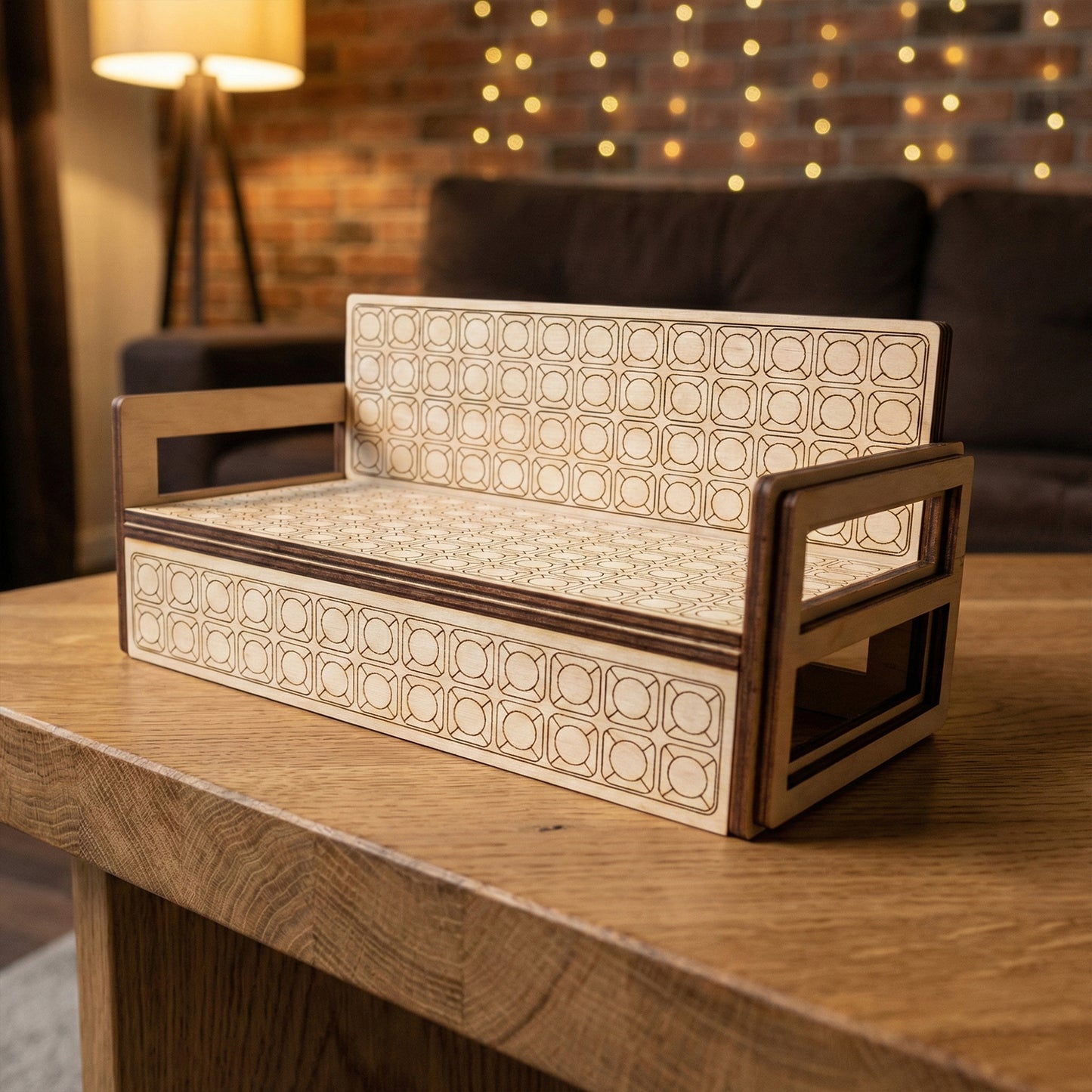 Detailed view of a miniature sofa crafted from laser cut plywood. The upholstery-like texture is achieved through fine geometric engraving. The double-layered armrests show high-quality assembly and natural wood finish.