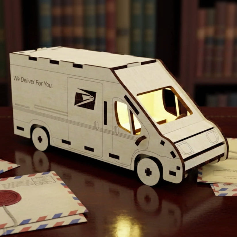 Laser cut wooden plywood mail truck with glowing interior light, featuring an engraved eagle logo and "We Deliver For You" text. The 3D model is on a desk with vintage letters, a wax seal, and a library background