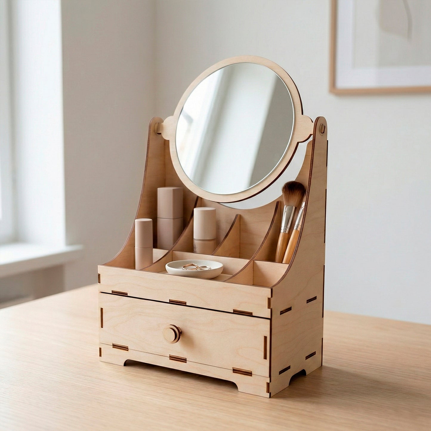 Desk-top birch plywood vanity organizer featuring a tilting circular mirror and multiple compartments for skincare and jewelry. Minimalist laser cut design shown in a bright, modern interior on a light wood tabletop.