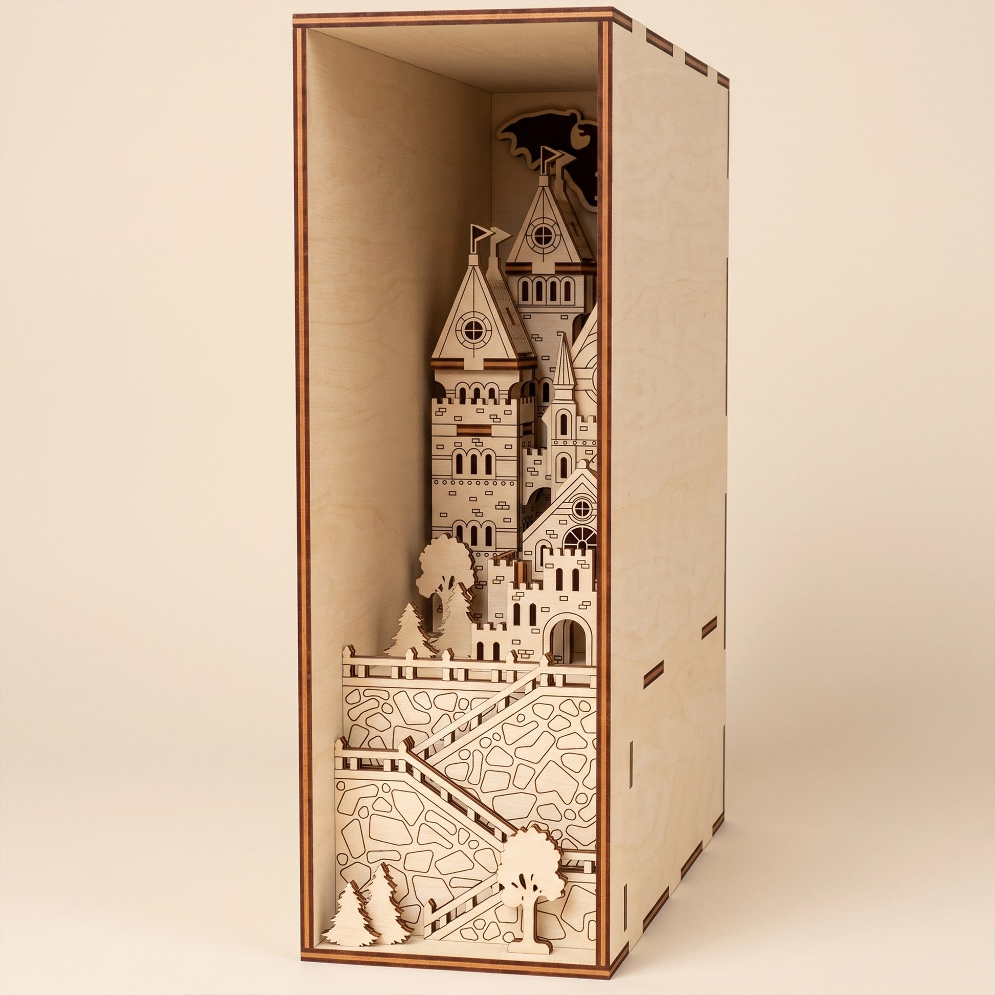 A complete, unlit laser cut plywood medieval castle book nook shown in full.