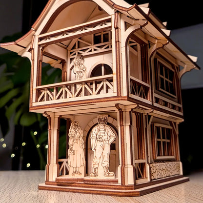 Low angle close-up of a medieval laser cut plywood townhouse showing three highly detailed wooden resident family figures.