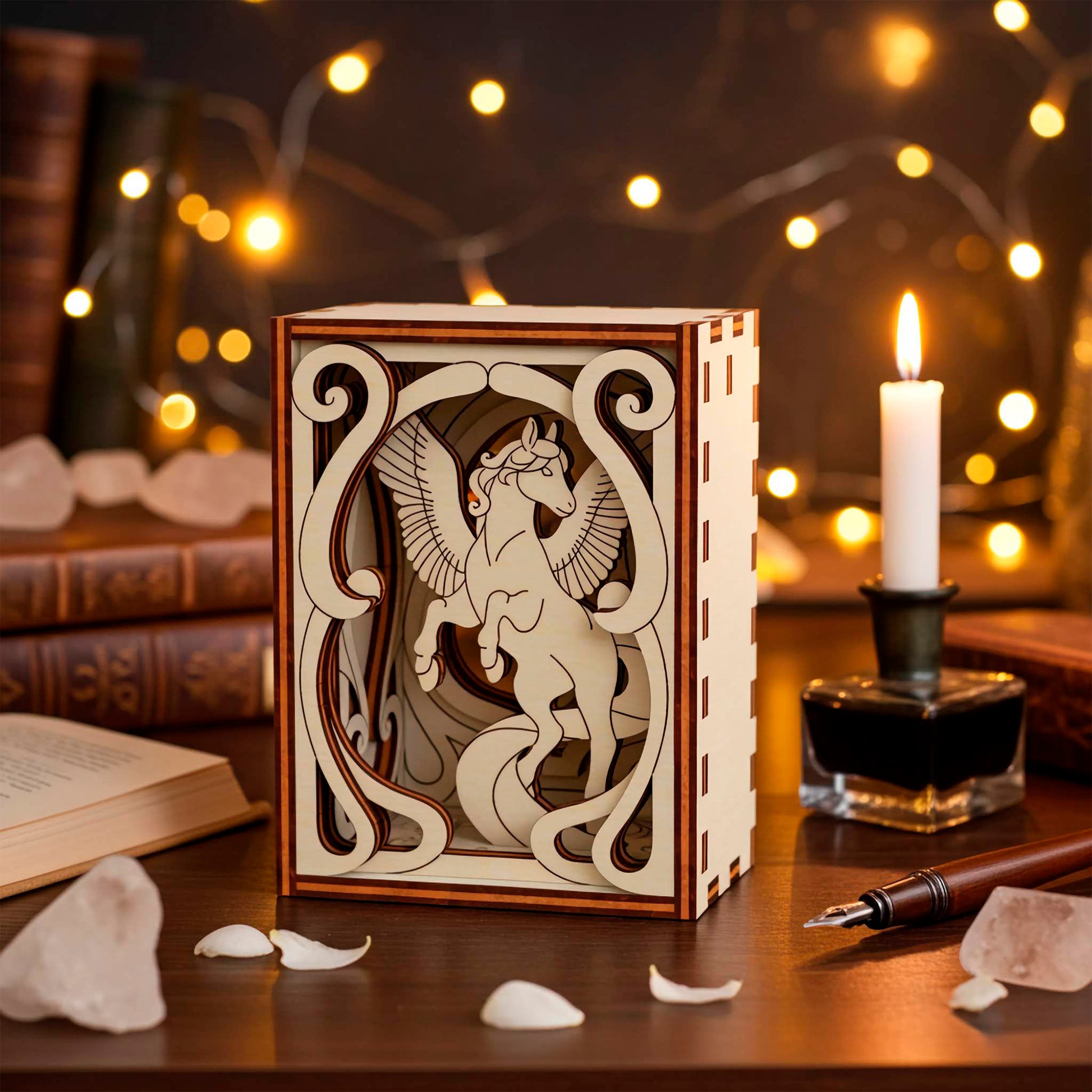 Decorative wooden box with intricate laser cut horse on a table with a candle and books in the background.