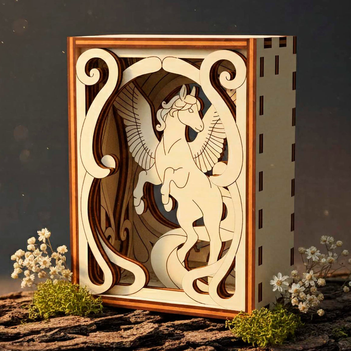 Decorative wooden box with a winged pegasus laser cut design on a dark background