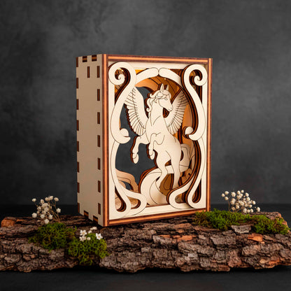 Wooden decorative box with a Pegasus laser cut design on a dark background