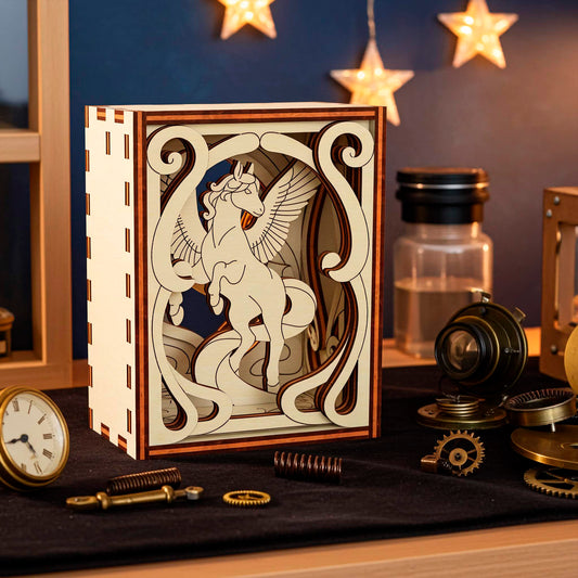 Decorative wooden box with intricate laser cut horse on a table with vintage items