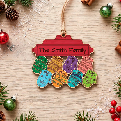 Colorful laser cut plywood family ornament featuring 8 painted, named mittens below a red "The Smith Family" nameplate.