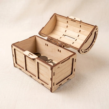 Wooden treasure chest laser cut model with a key on a light background