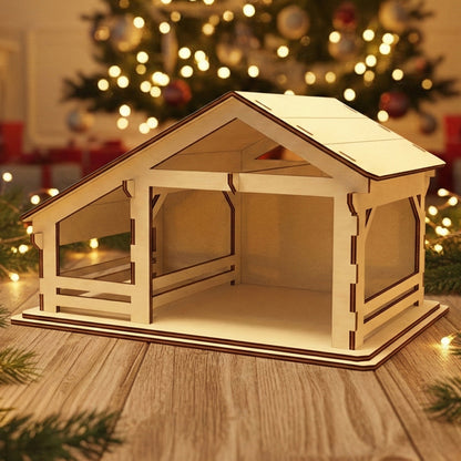 Wooden laser cut Nativity barn #1 with open stable design and detailed roof beams, ready for figures, displayed against a softly blurred Christmas tree background.