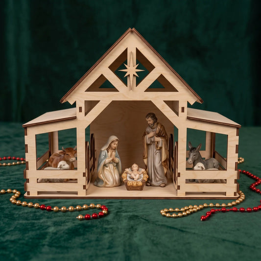 Front direct shot of laser cut plywood nativity stable with ceramic figurines on dark green velvet fabric.