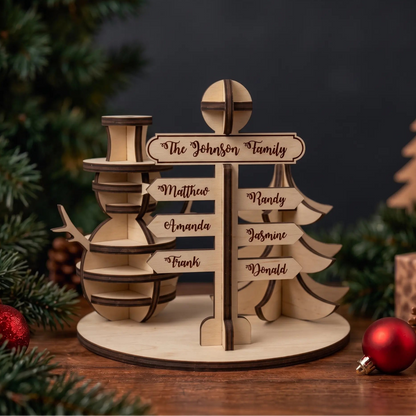 Personalized laser cut plywood North Pole direction signpost with 3D snowman and pine tree on festive table