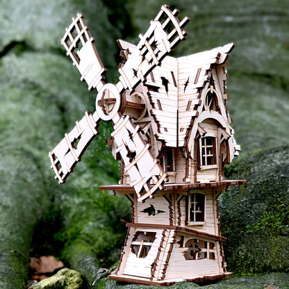 A beautiful straight eye-level front look at an assembled miniature spooky village windmill built of laser cut plywood lines.